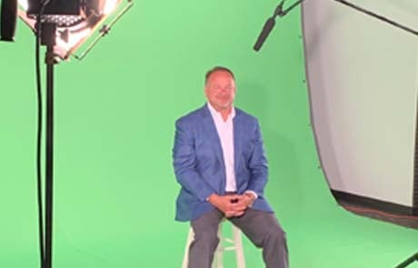 john hiester on green screen for north carolina auto dealers association video